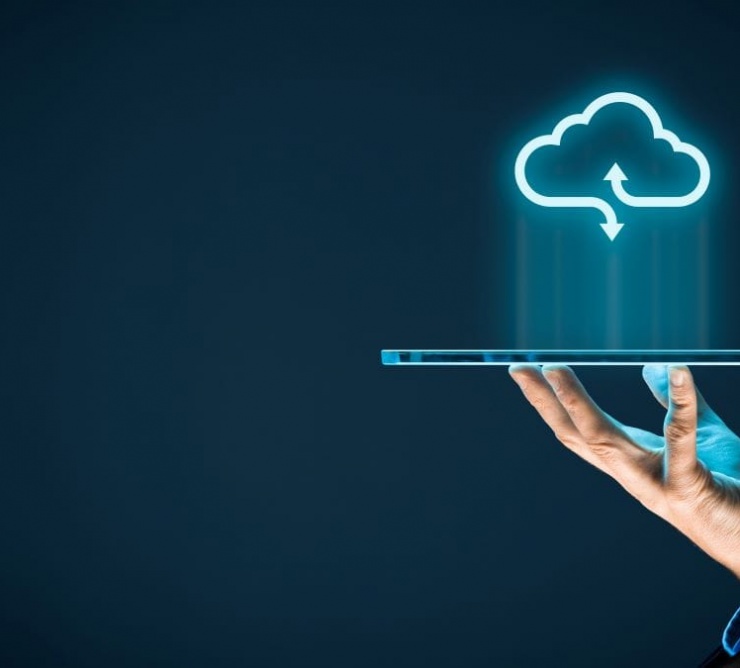 person holding tablet with cloud icon