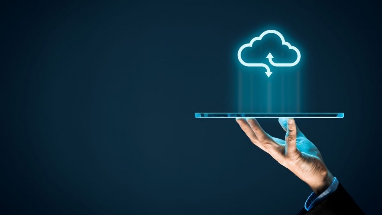 person holding tablet with cloud icon
