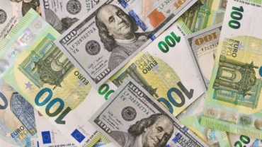 Money bills in US dollars and Euros